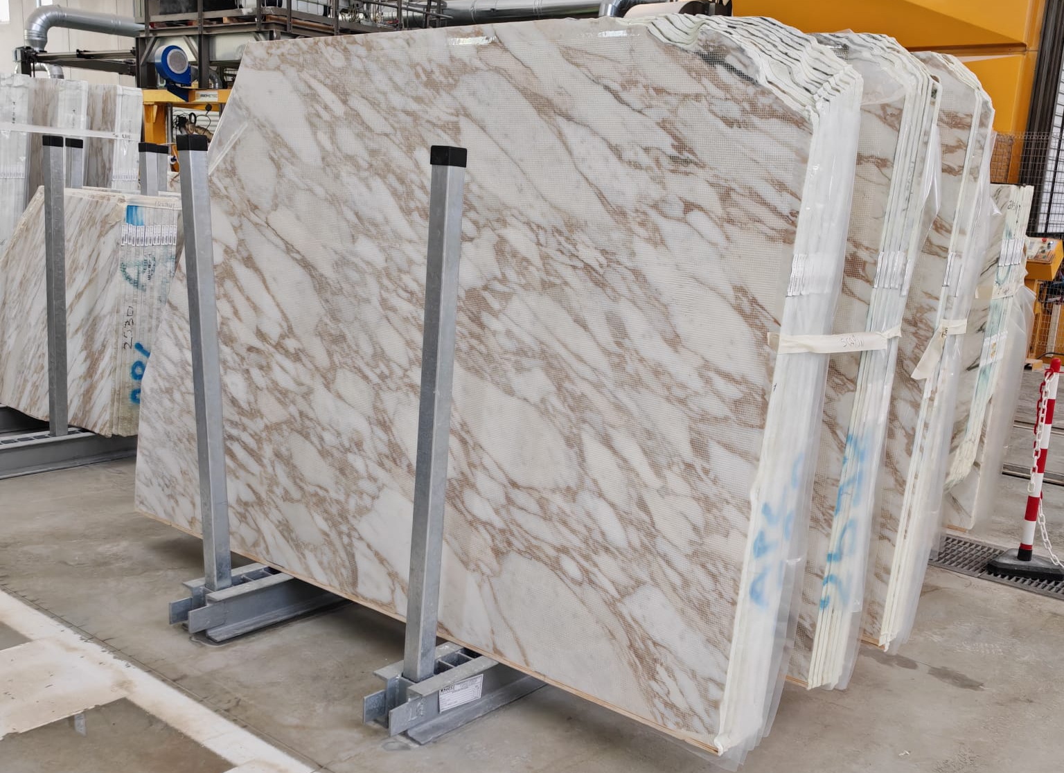 Calacatta Oro marble: warm white background with distinctive gold veining — the most luxurious Calacatta